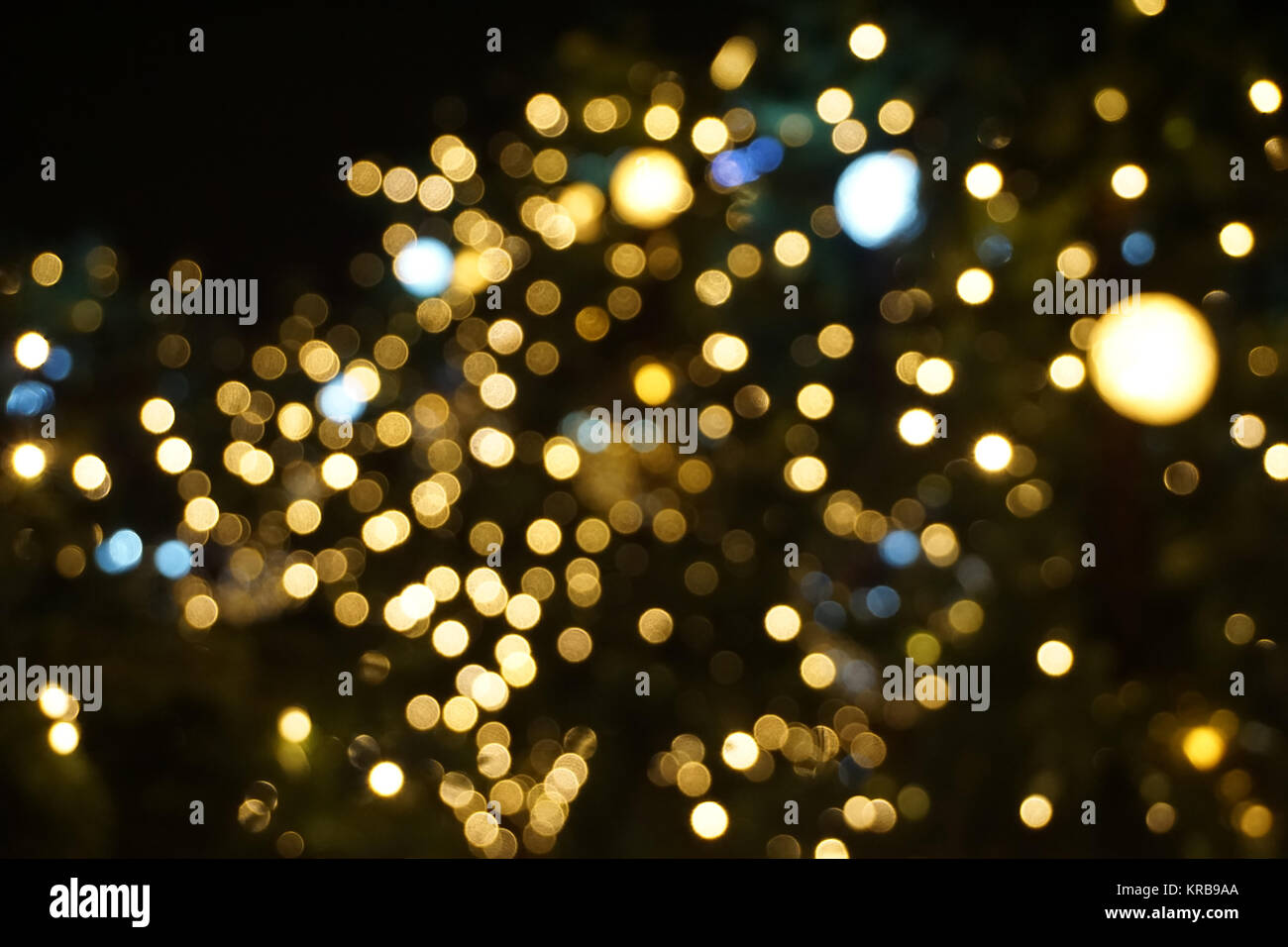 Golden abstract bokeh on a black background Stock Photo - Alamy