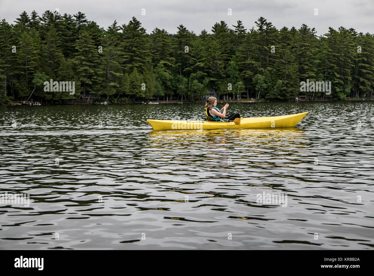 family kayaking on Flying Pond, Mount Vernon, Maine Stock Photo Alamy