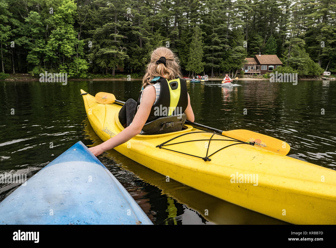 family kayaking on Flying Pond, Mount Vernon, Maine Stock Photo Alamy