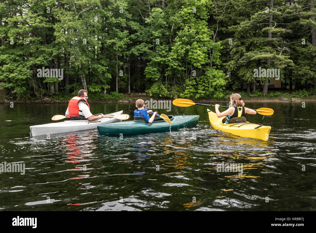 family kayaking on Flying Pond, Mount Vernon, Maine Stock Photo Alamy