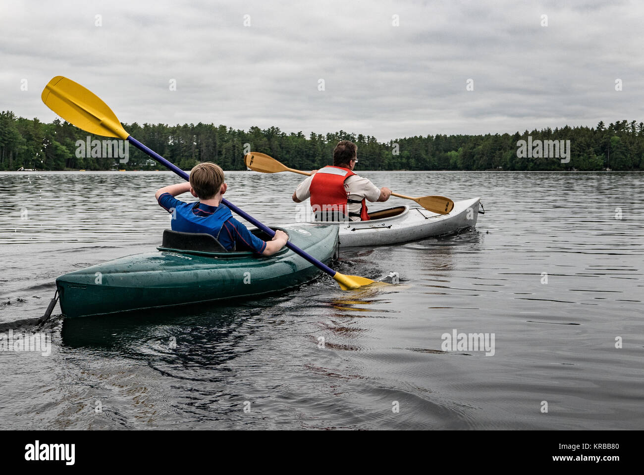 family kayaking on Flying Pond, Mount Vernon, Maine Stock Photo Alamy
