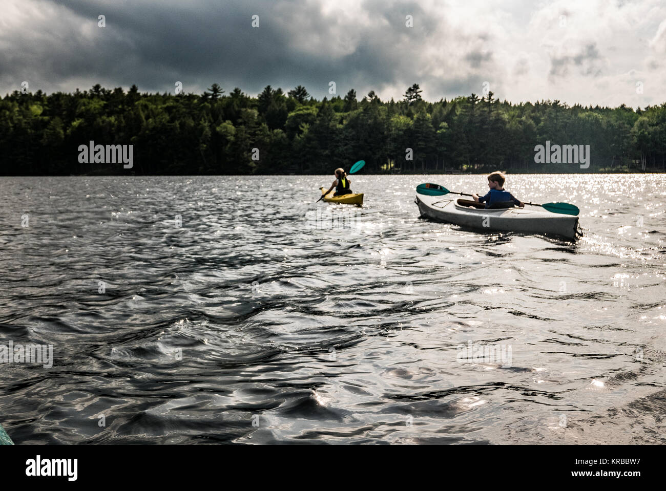 family kayaking on Flying Pond, Mount Vernon, Maine Stock Photo Alamy
