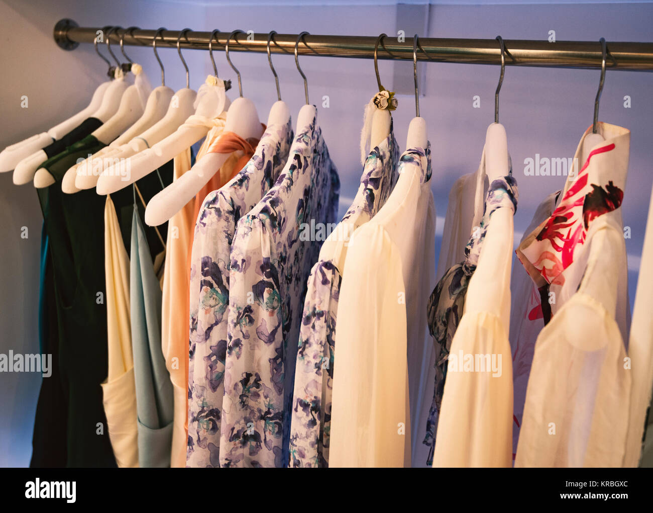 Girl clothes on hangers in a fashion store Stock Photo Alamy