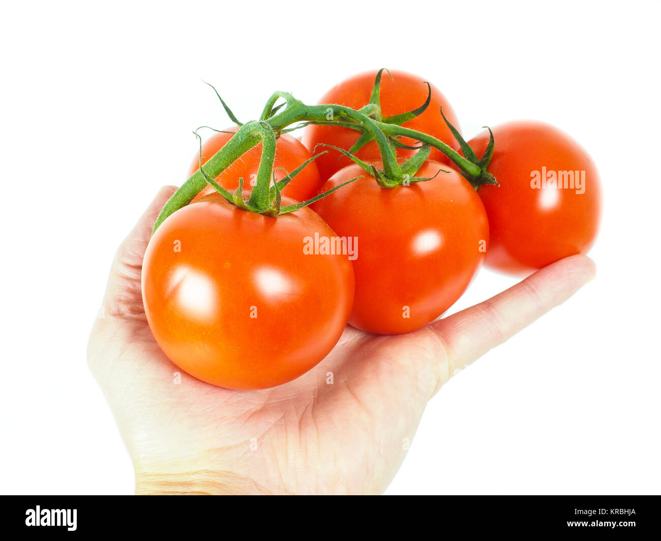 Person holding a bunch of tomatoes Stock Photo - Alamy