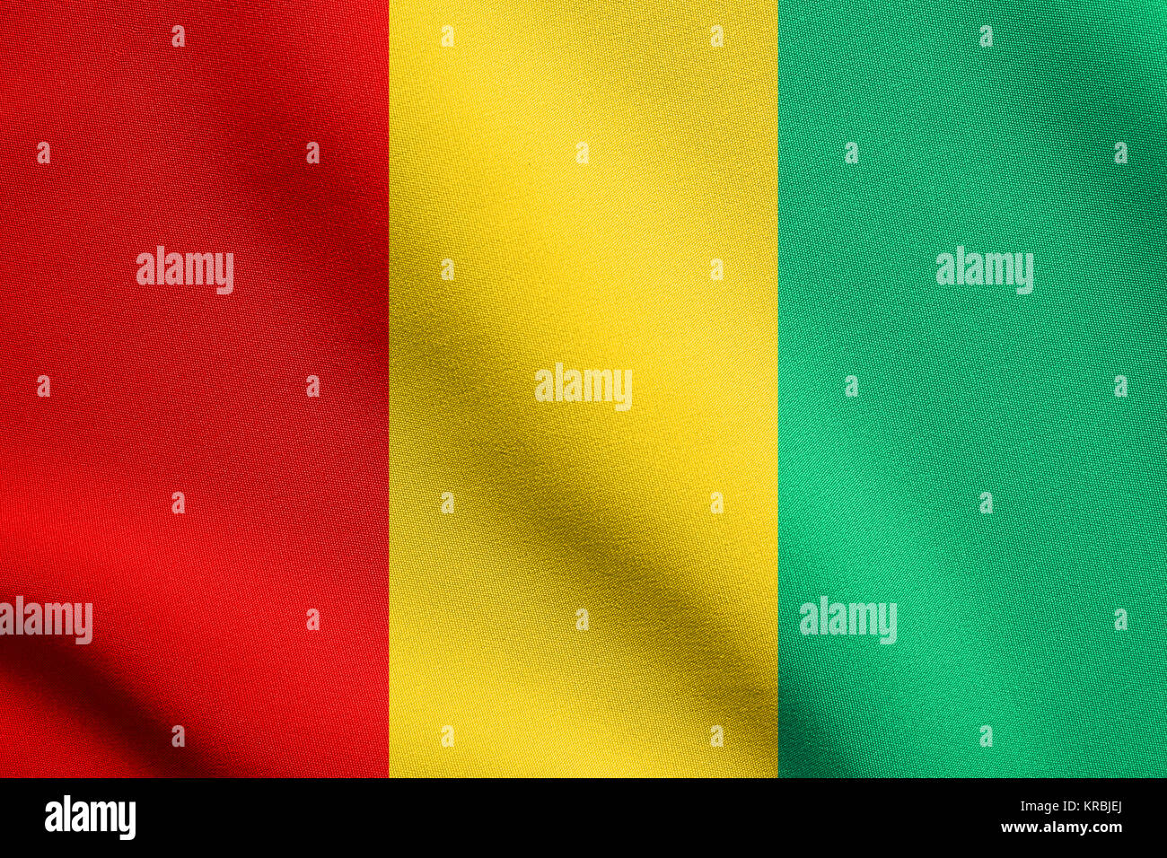 Flag of Guinea waving with fabric texture Stock Photo