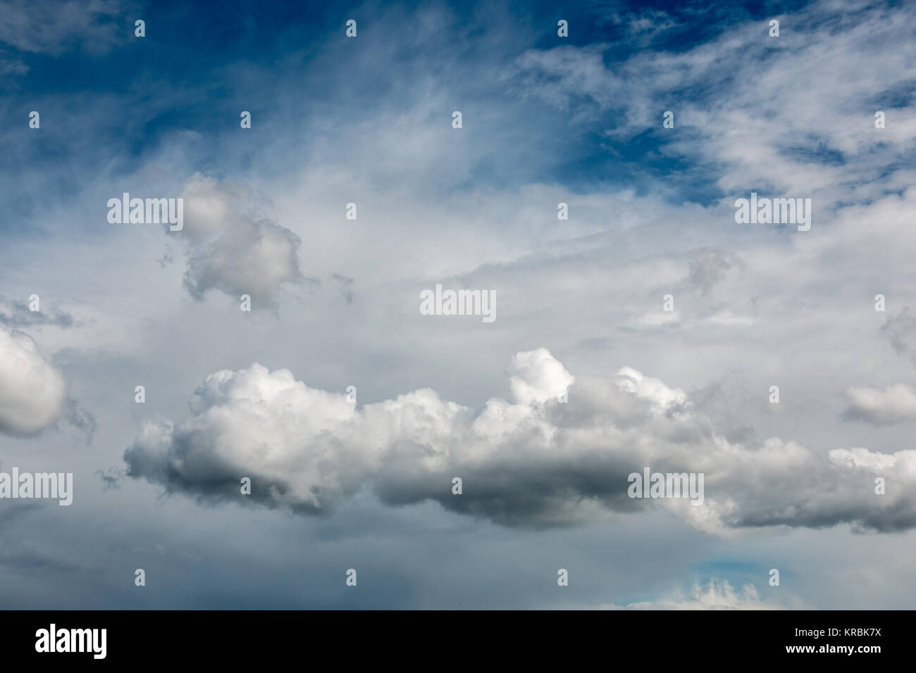 Dramatic blue sky and white and gray clouds Stock Photo