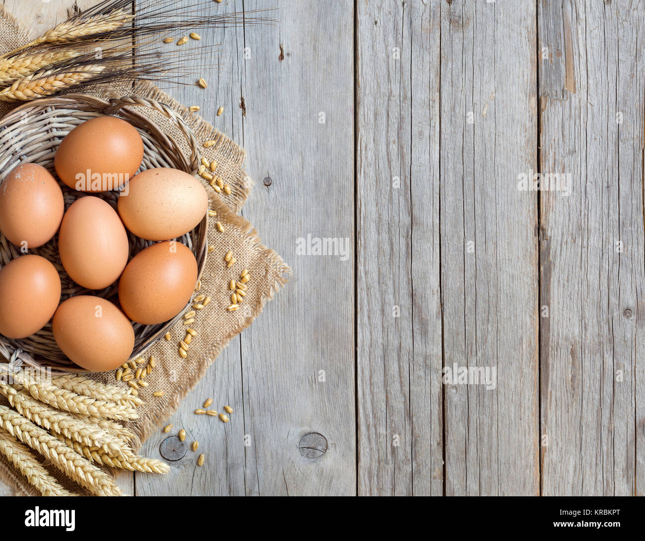 Chicken eggs and wheat Stock Photo Alamy