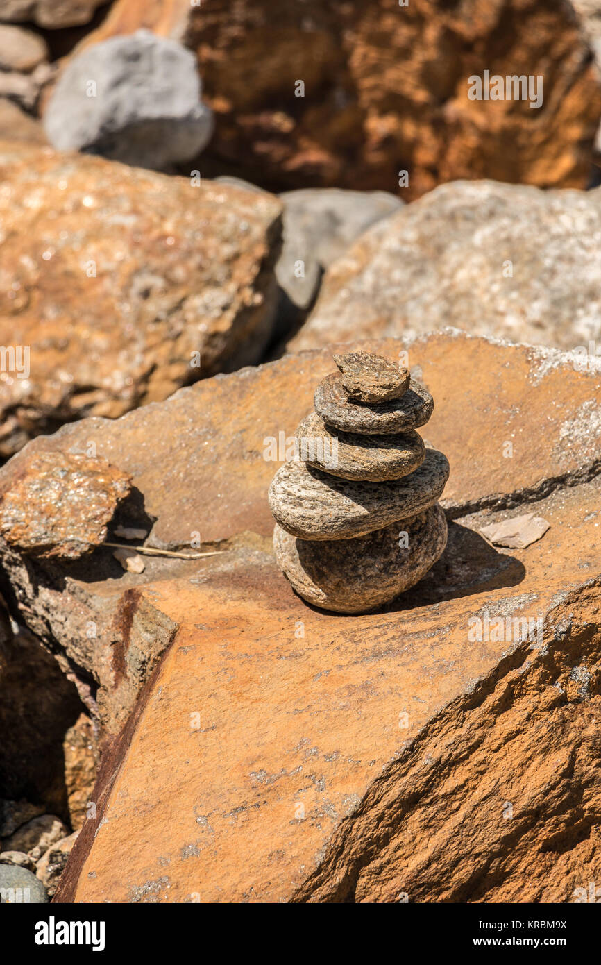 Little towers made of stone built on a rock Stock Photo - Alamy