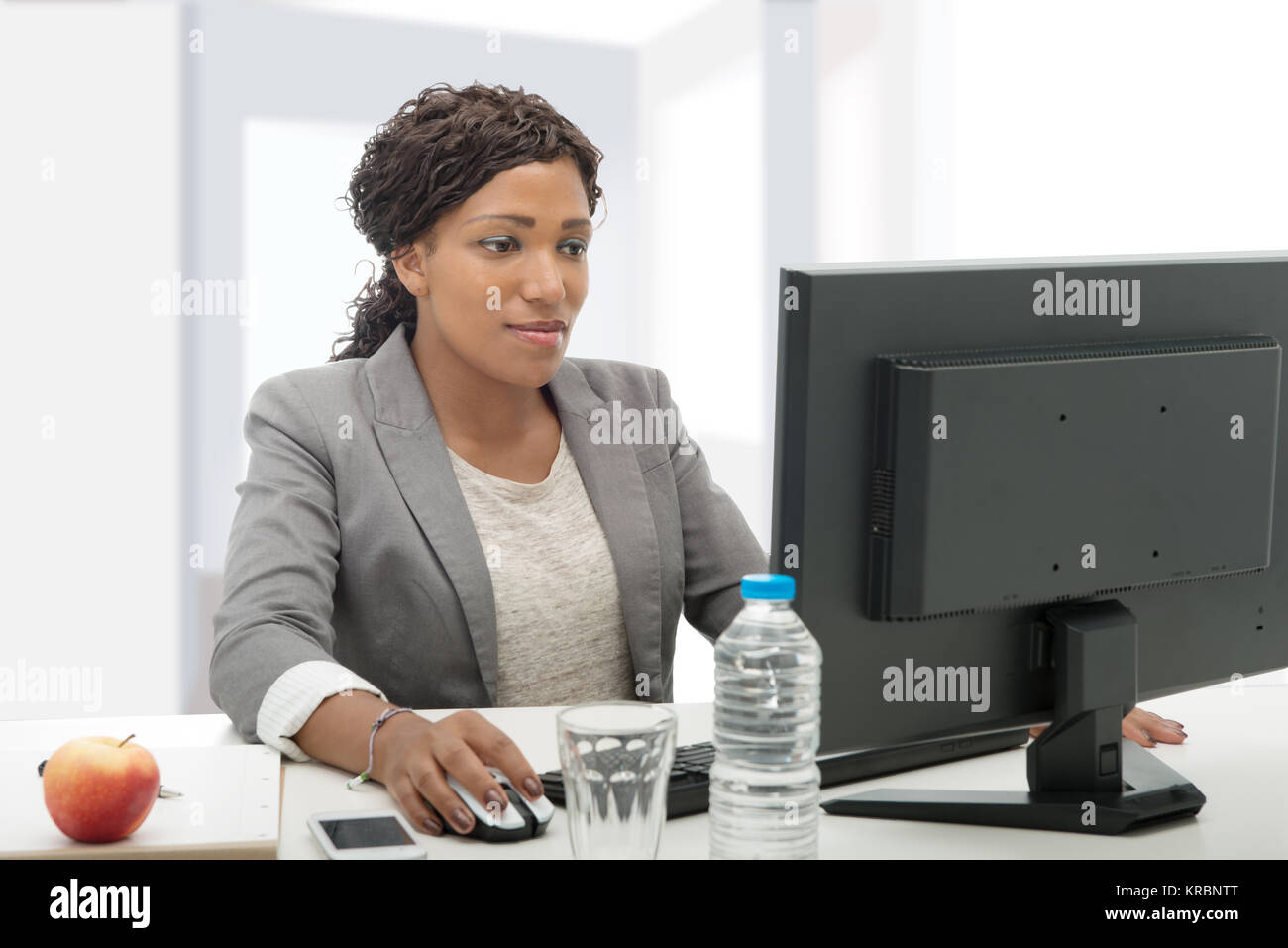 African american business woman working with computer Stock Photo - Alamy