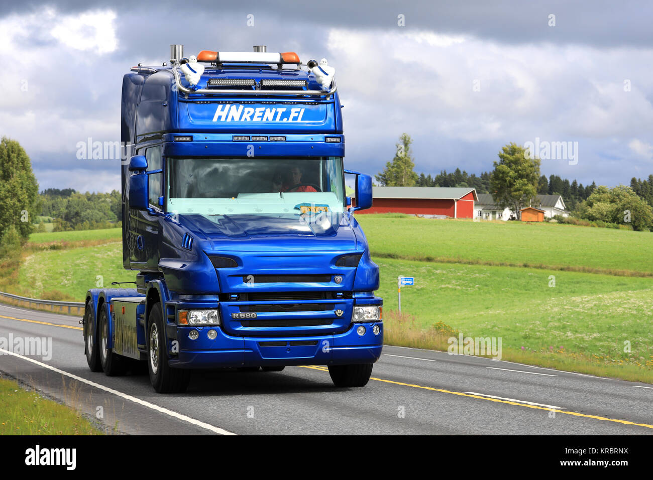 IKAALINEN, FINLAND - AUGUST 13, 2017: Blue Scania R580 truck with conventional cab of HN Rent.fi moves along highway at summer. Stock Photo