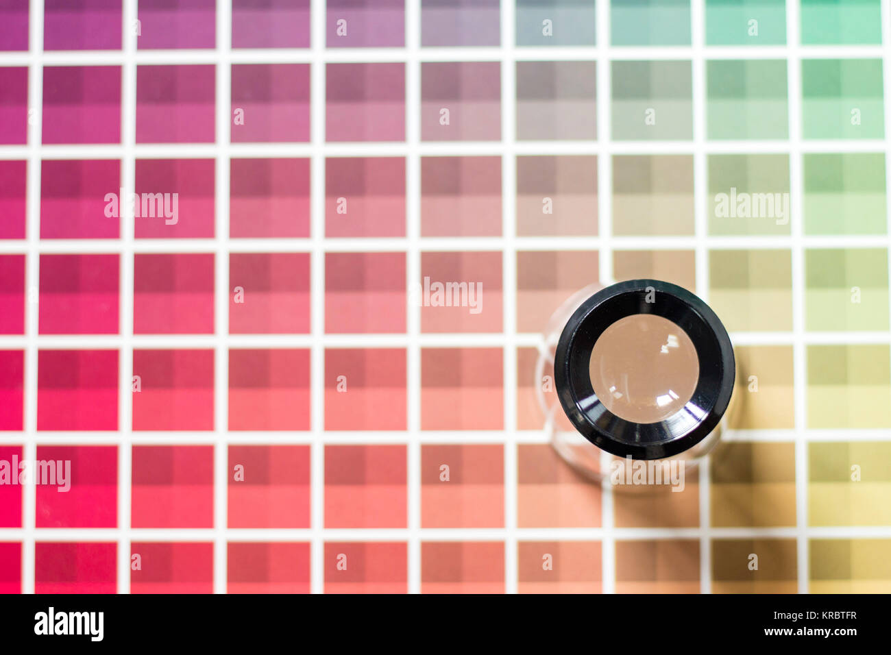 Magnifier on a color chart Stock Photo