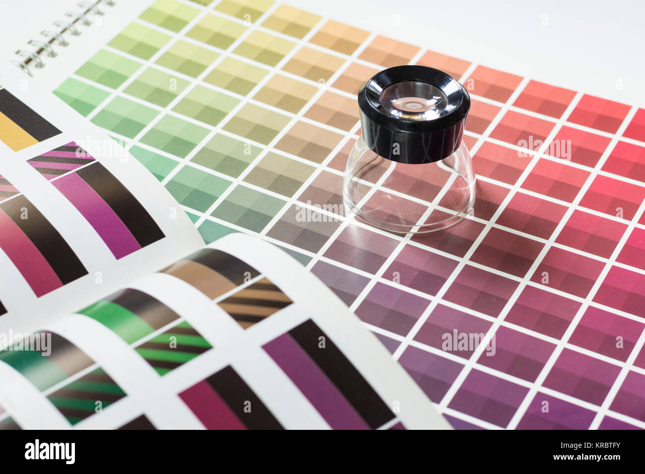 Magnifier on a color chart Stock Photo