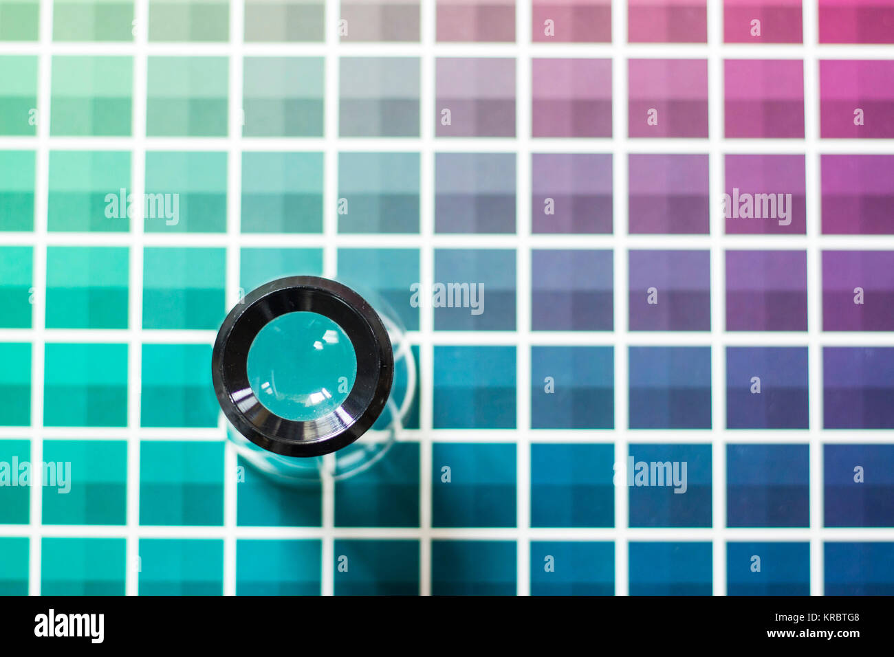 Magnifier on a color chart Stock Photo