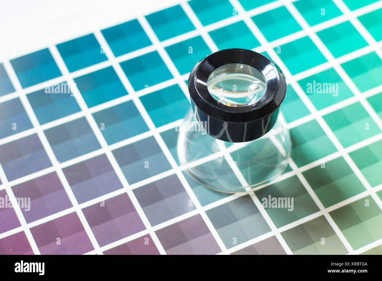 Magnifier on a color chart Stock Photo