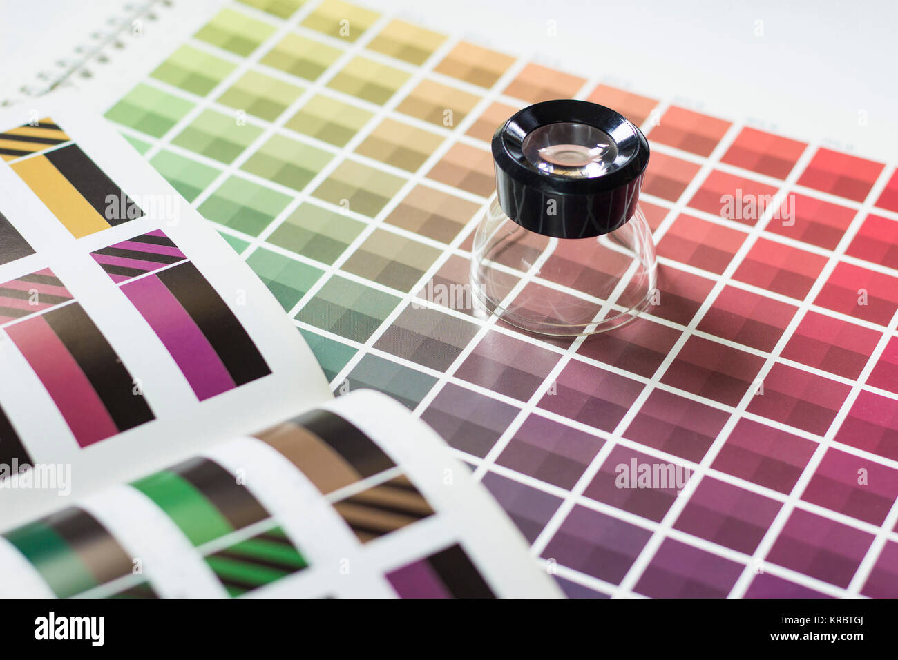 Magnifier on a color chart Stock Photo