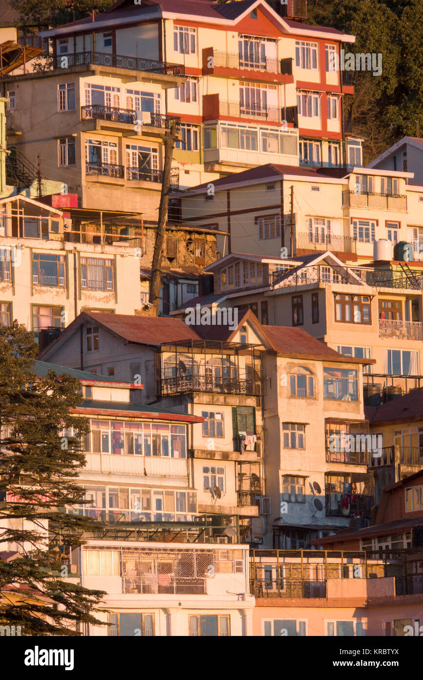 Tiered houses on steep mountainside in Shimla, India Stock Photo