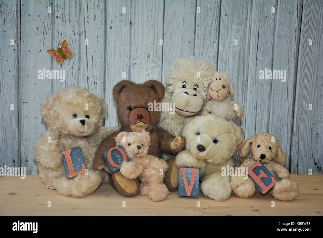 many teddy bears and soft toys with the word love Stock Photo