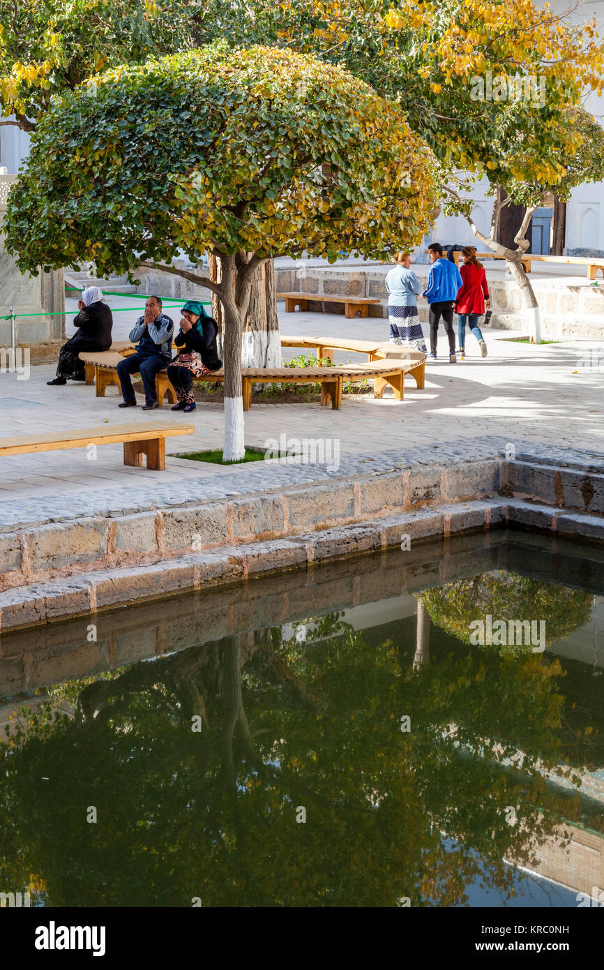 Muslim People Praying At The Memorial Complex Of Naqshbandi, Bukhara, Uzbekistan Stock Photo