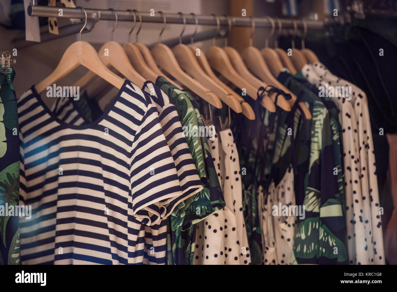 Fancy clothing on racks in a store in Paris Stock Photo - Alamy
