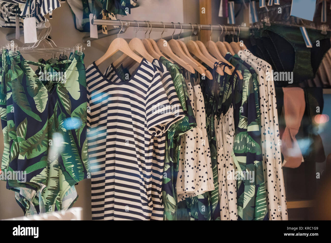 Fancy clothing on racks in a store in Paris Stock Photo - Alamy