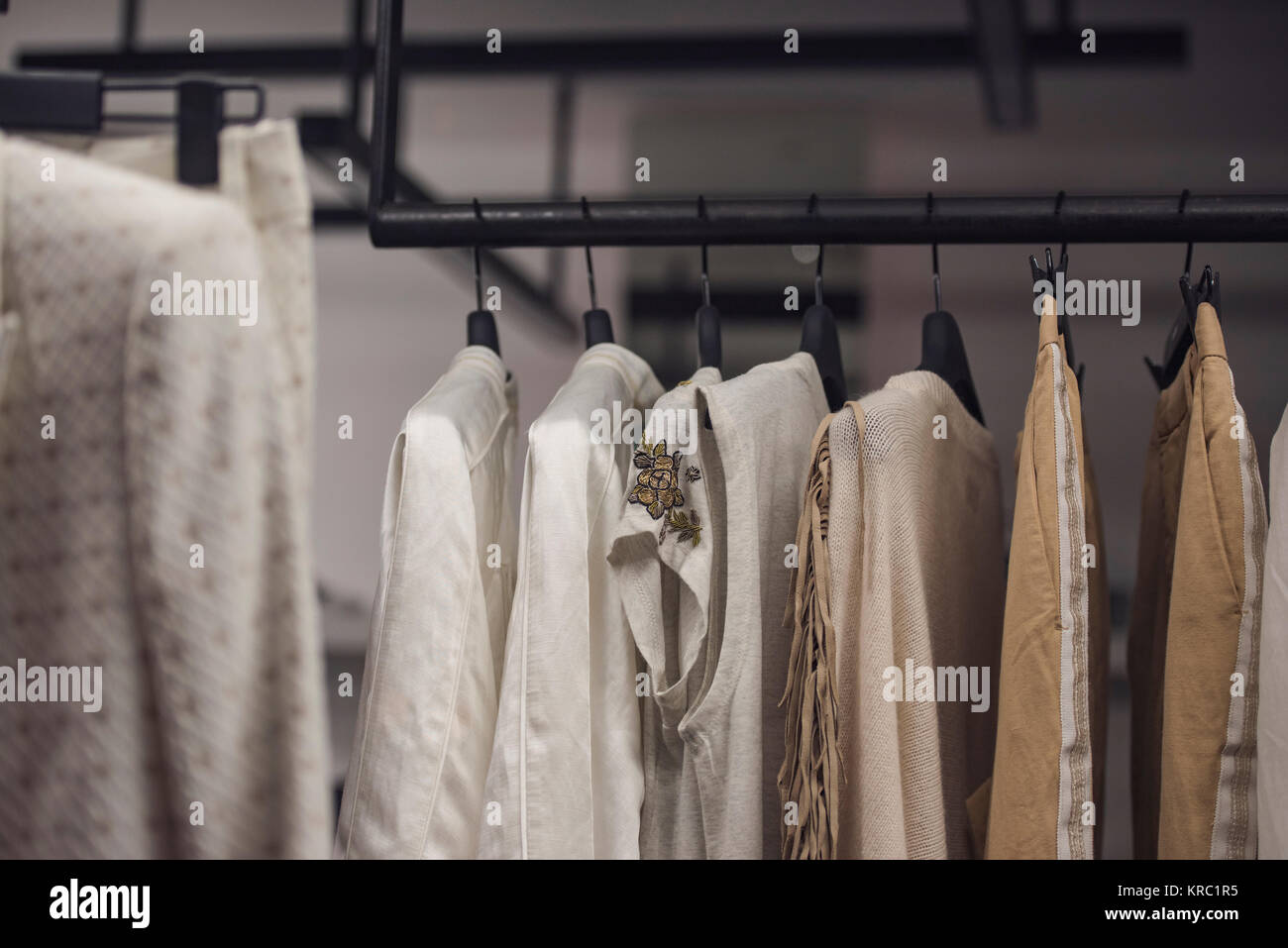 Fancy clothing on racks in a store in Paris Stock Photo - Alamy