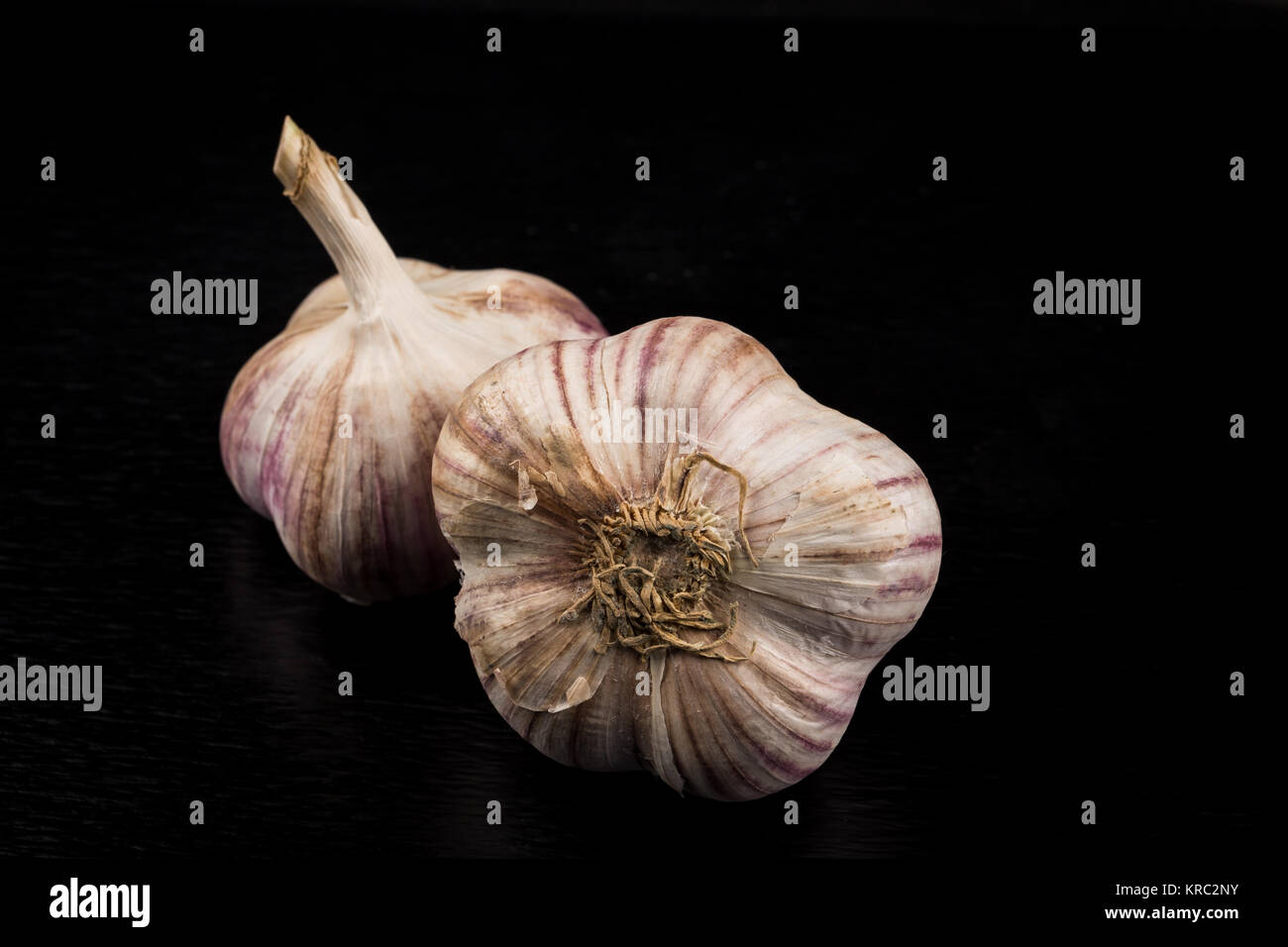 Garlic bulb on dark background Stock Photo - Alamy