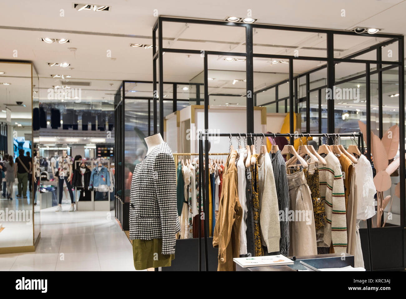 Women clothes in front with store background in Paris Stock Photo - Alamy