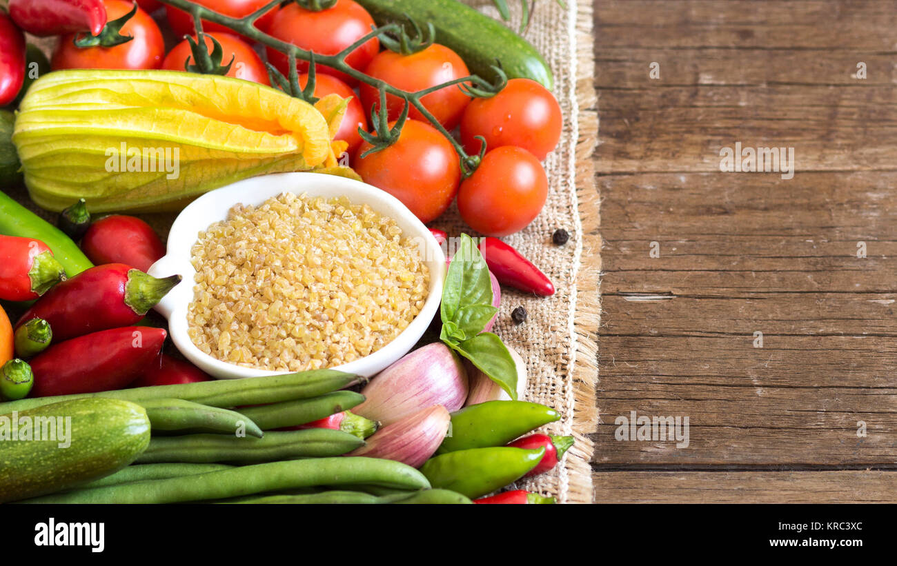 Bulgerty Eatable Raw Organic bulgur in bowl and vegetables Stock Photo - Alamy