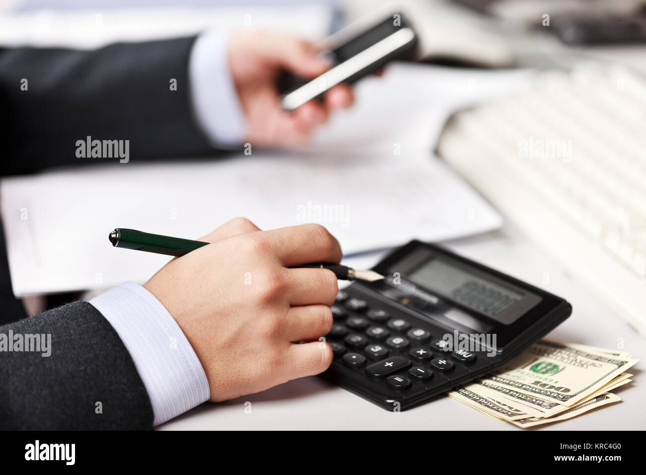 Working business man hand pen writing paper document at office ...