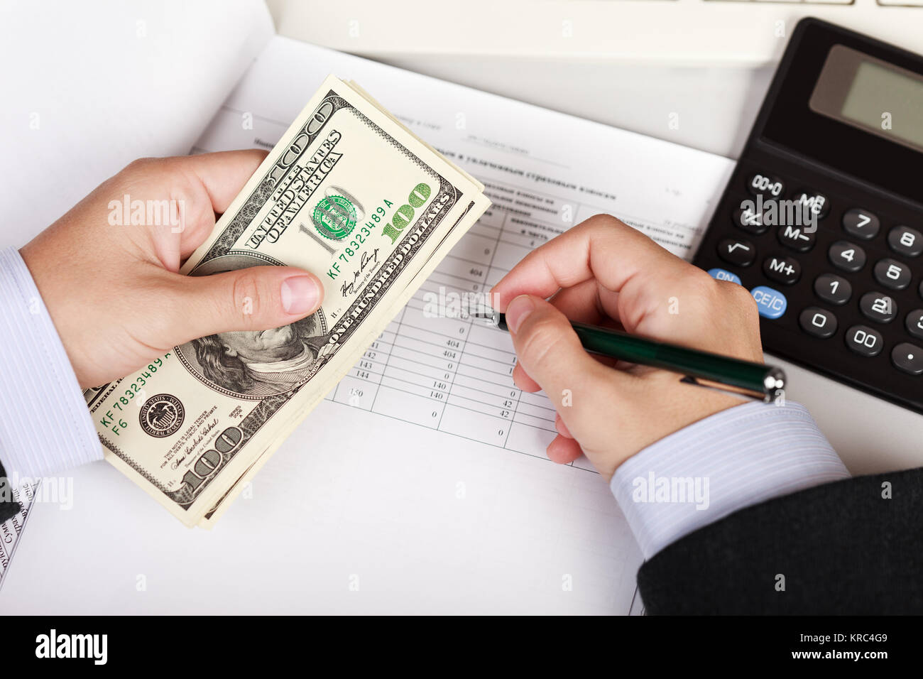 Working business man hand pen writing paper document at office ...