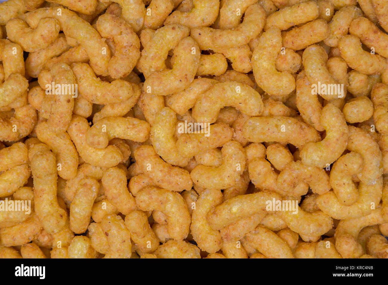 Many peanut chips as a texture background. Stock Photo