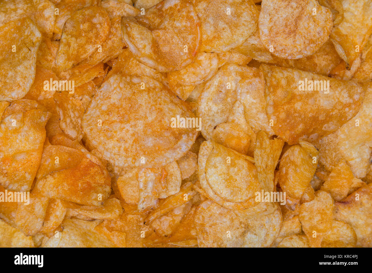 Many potato chips as a texture background. Stock Photo