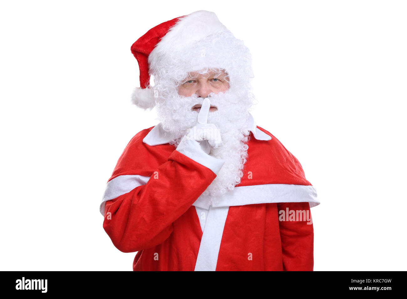 Weihnachtsmann Nikolaus hat Weihnachten Geheimnis Freisteller freigestellt vor einem weissen Hintergrund Stock Photo