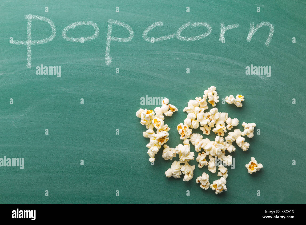 Popcorn on green chalkboard Stock Photo Alamy