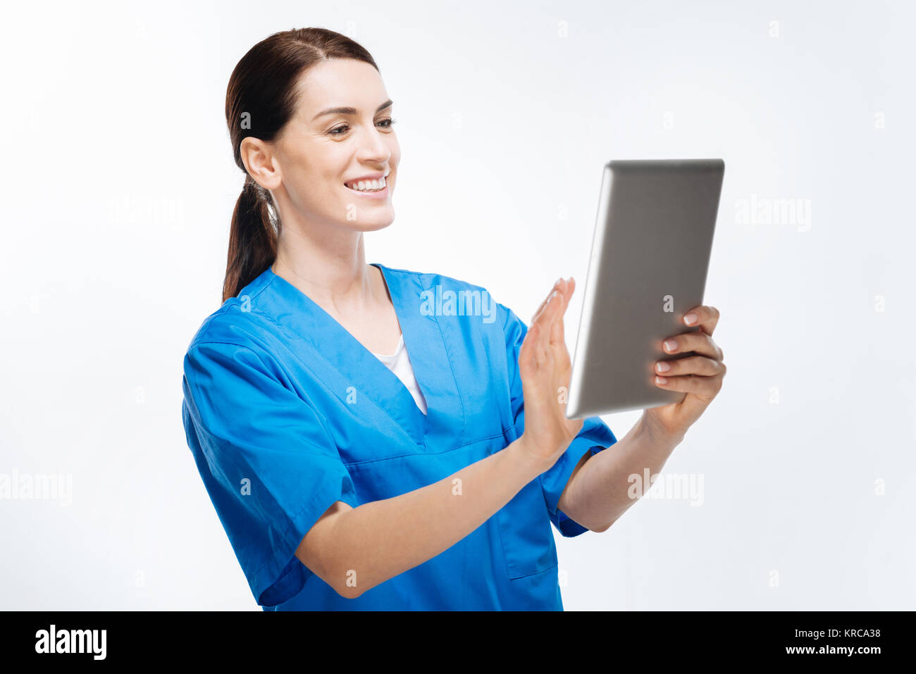 Pleasant female doctor filling patient chart Stock Photo Alamy