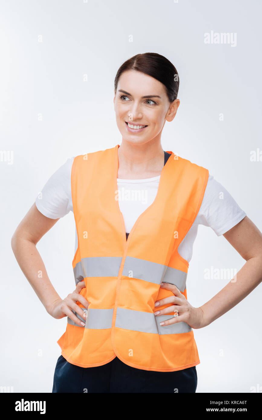 Good looking female engineer dressing in orange vest Stock Photo Alamy