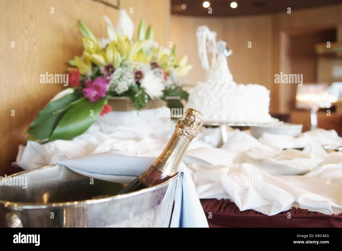 Bottle of champagne and wedding cake with a bouquet of flowers Stock ...