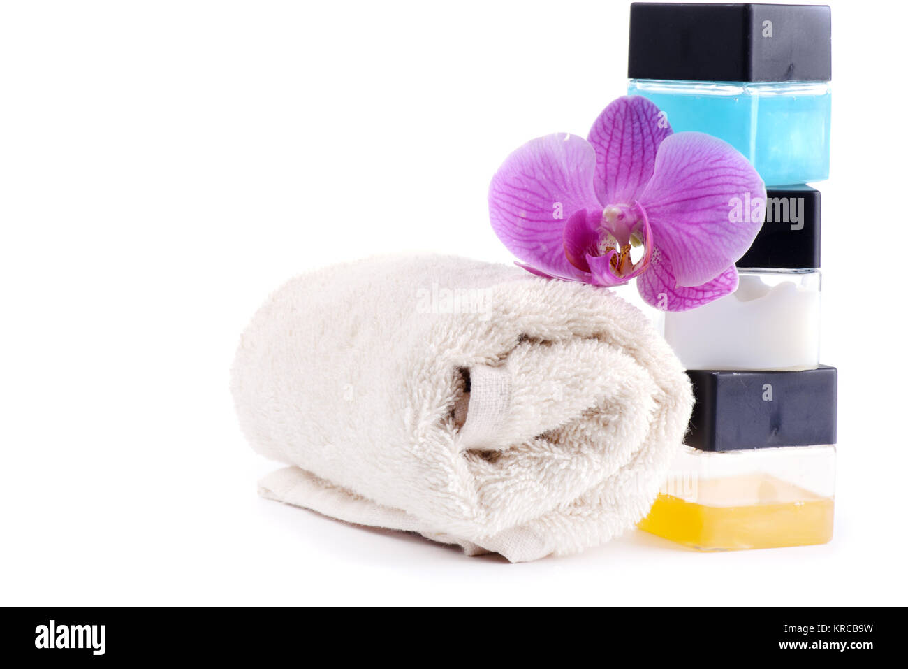 Stack of spa accessories with flower and towel Stock Photo