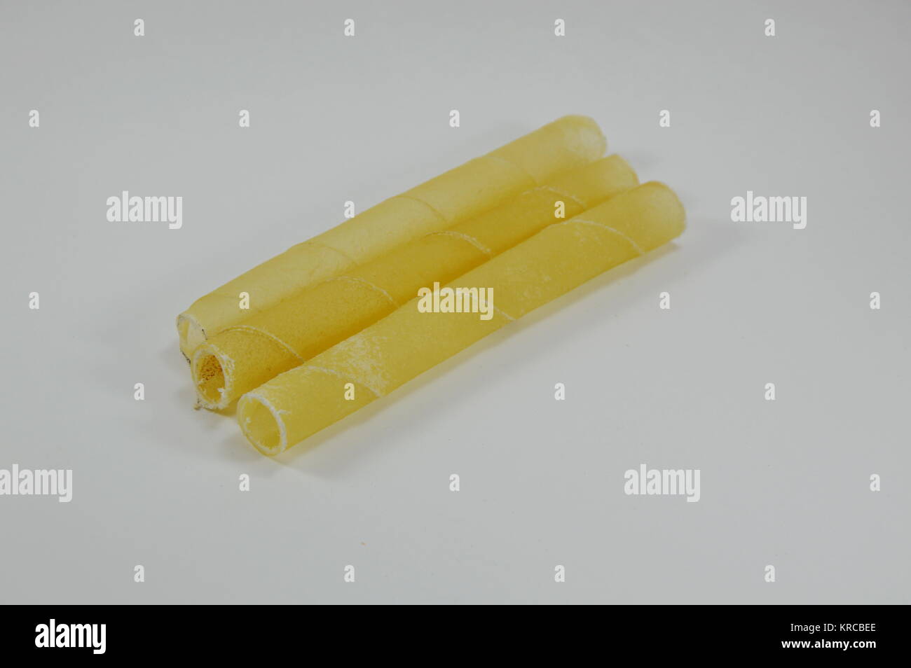 dog chew made from cow leather on white background Stock Photo Alamy