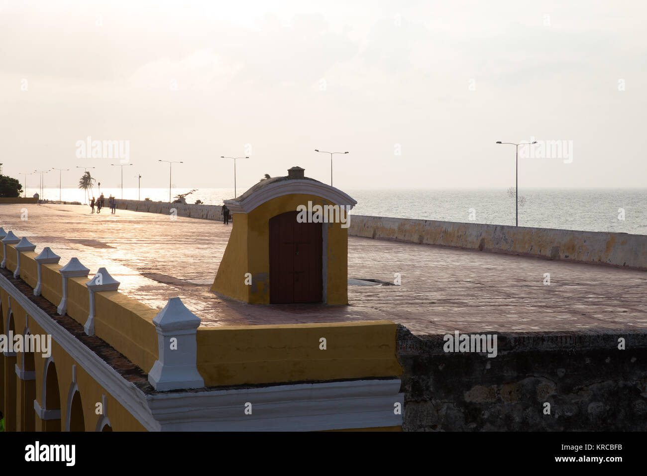 Tourists stroll along the historic city walls of Cartagena in Colombia Stock Photo