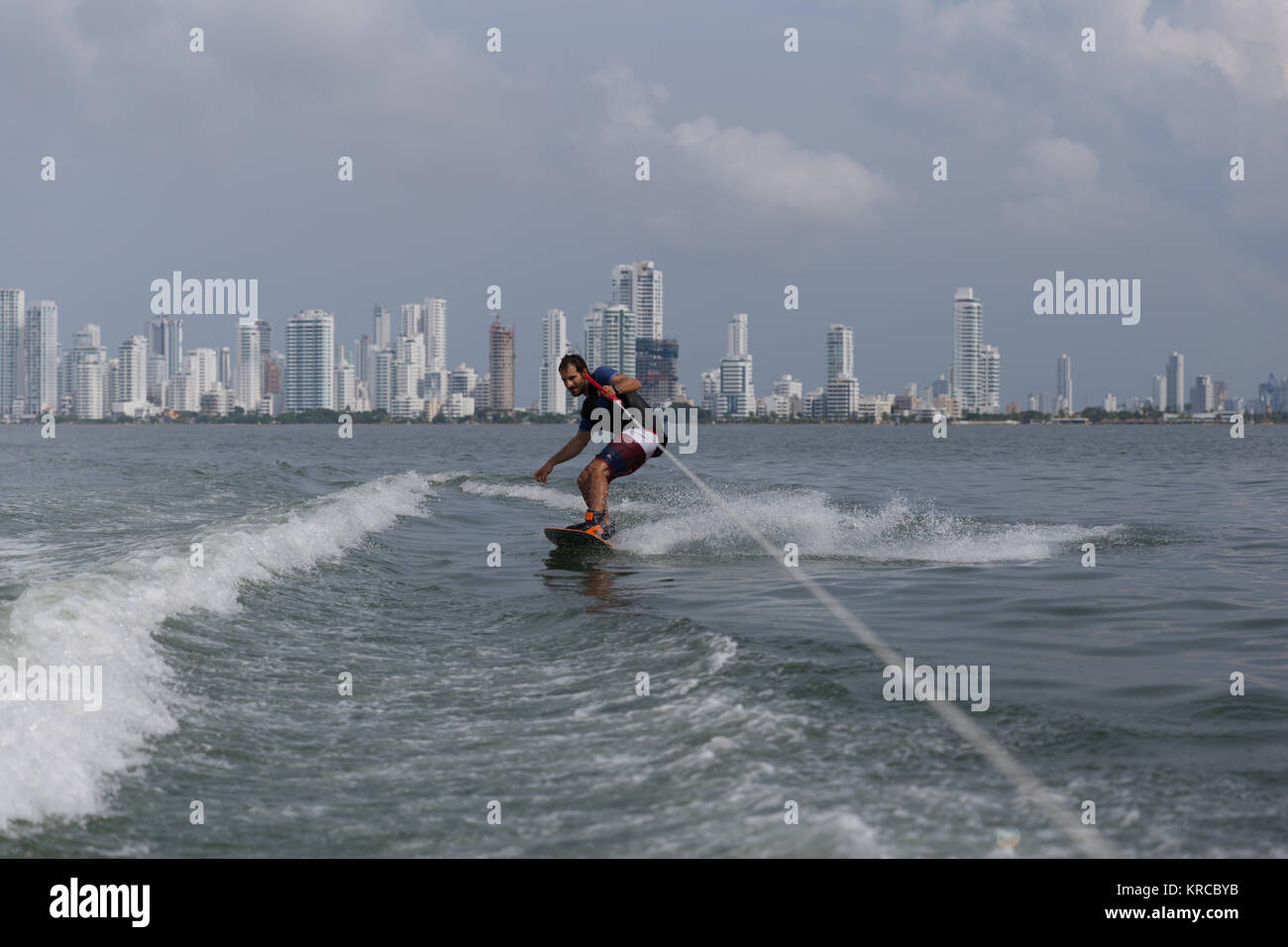 Wakeboarding man in front of Cartagena new city Stock Photo