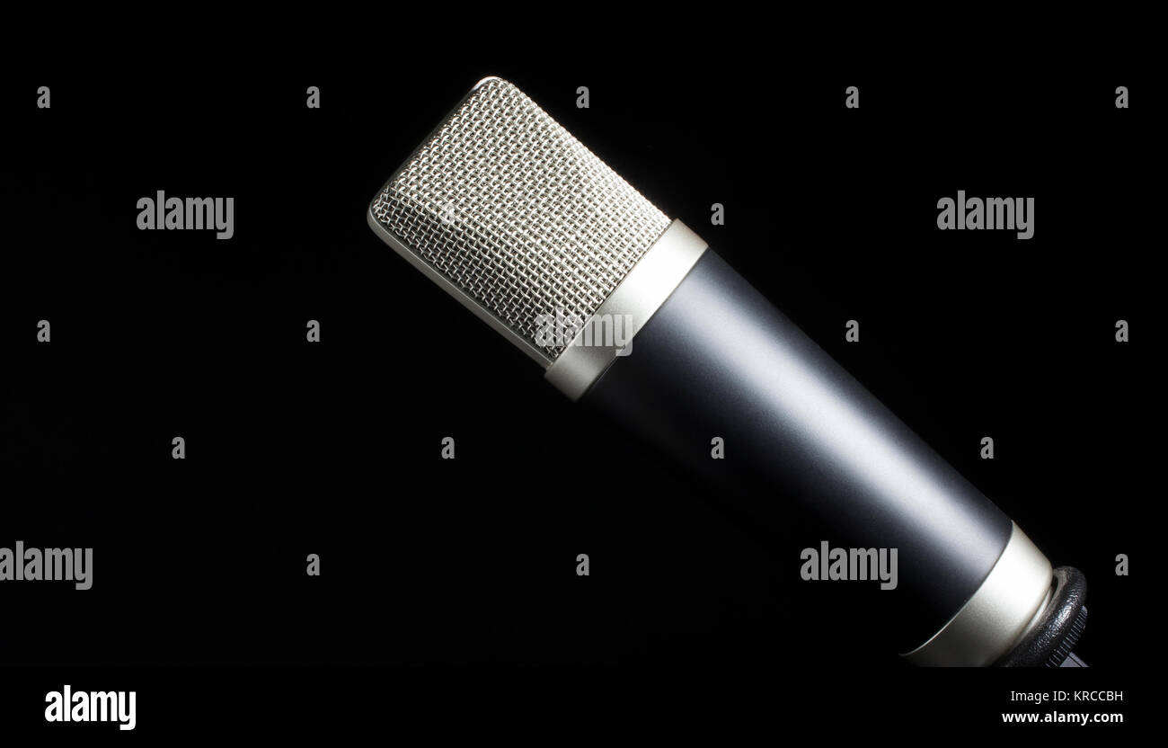 Mike covered in a silver wire mesh with a black background Stock Photo ...