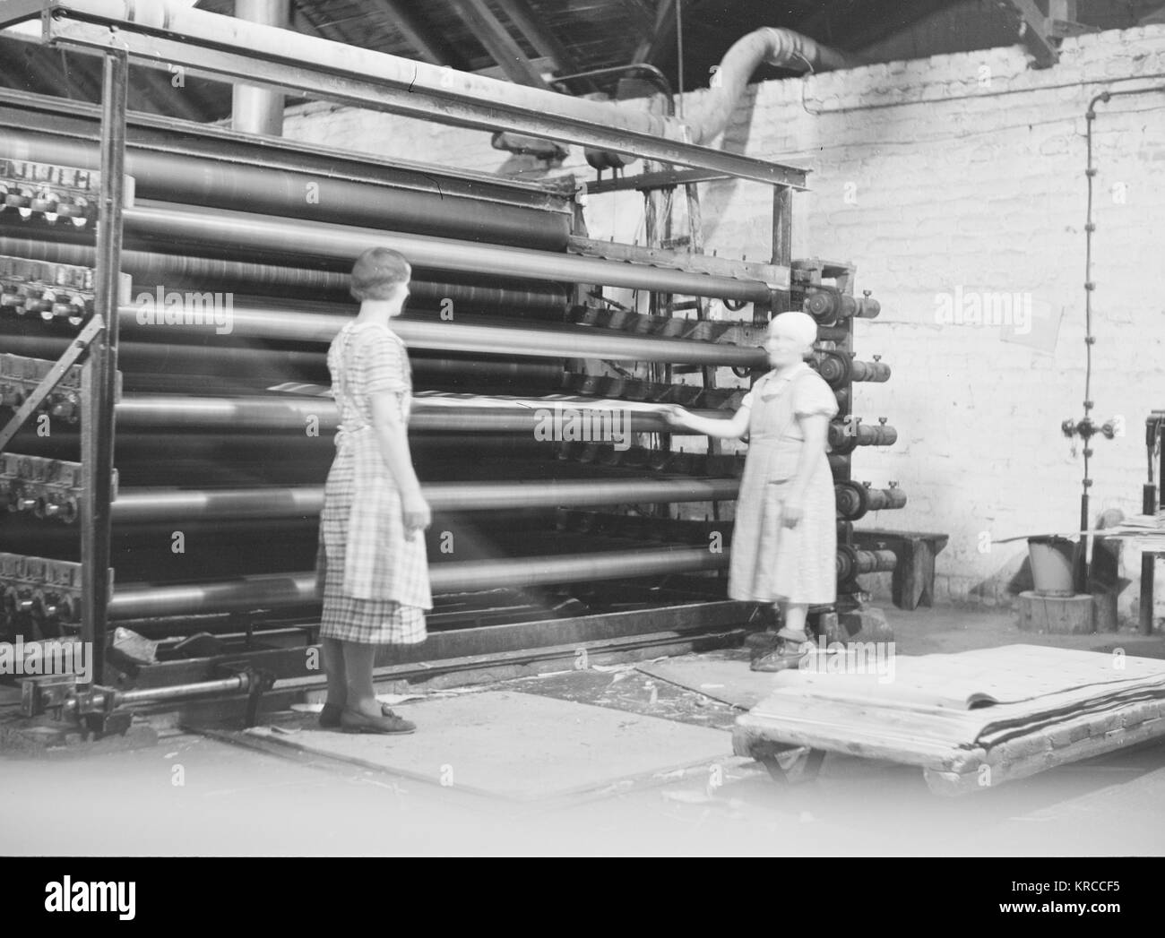 Two female employees are assembling finished cardboard boards in a factory, Finland 1930s Stock Photo