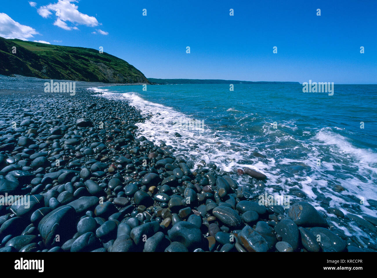 Greencliff Beach - Pebble View at Mid Tide, Looking South West towards Bucks Mills, Devon, UK. Stock Photo