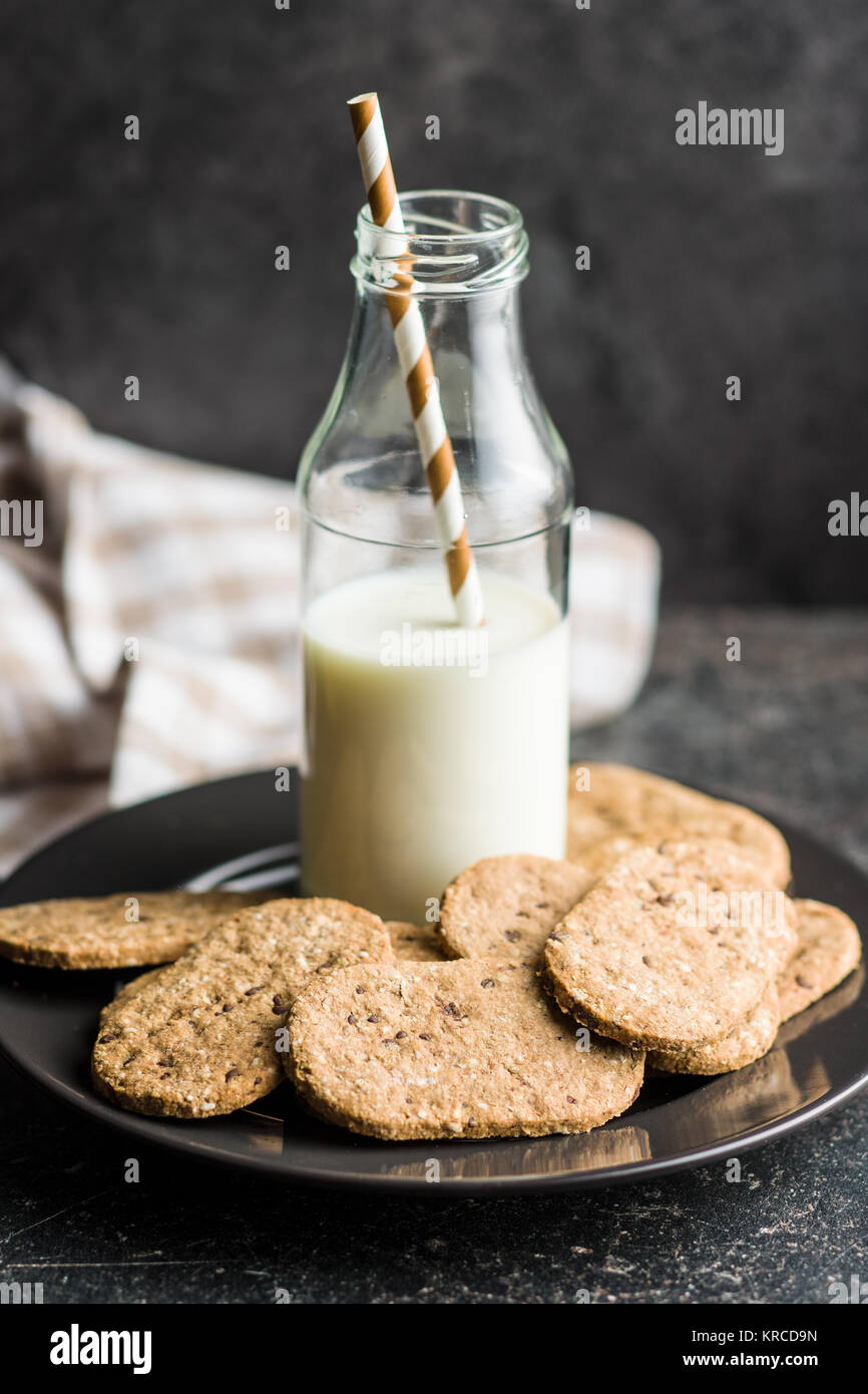 Tasty oatmeal cookies and milk Stock Photo Alamy