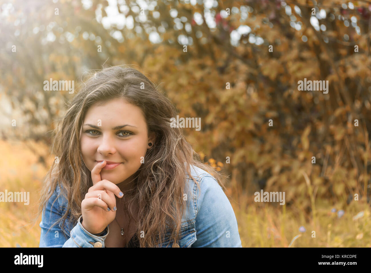 Portrait of pensive smiling teenage girl Stock Photo - Alamy