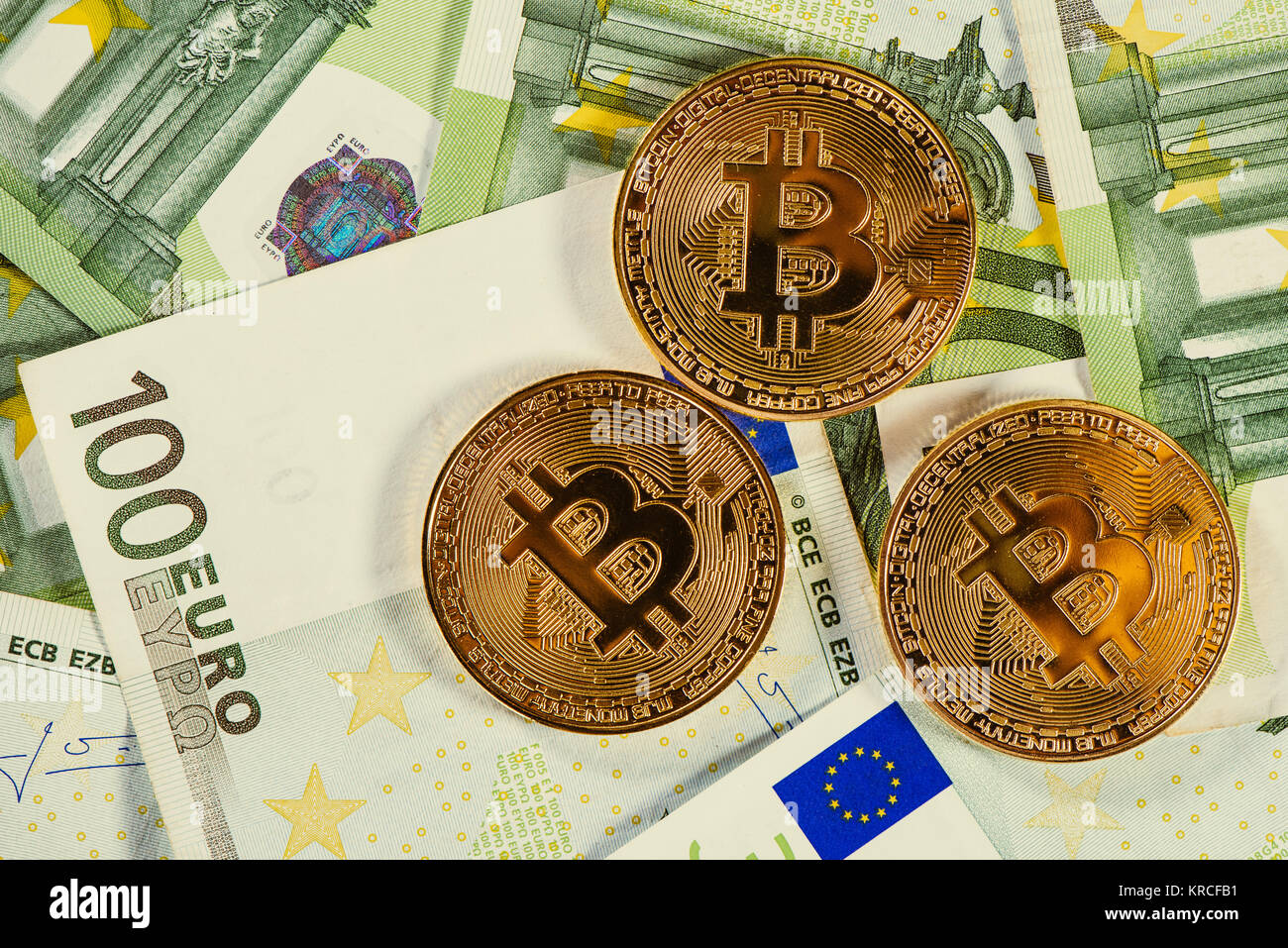 Bitcoins and euros, money and currency exchange rate concept Stock Photo