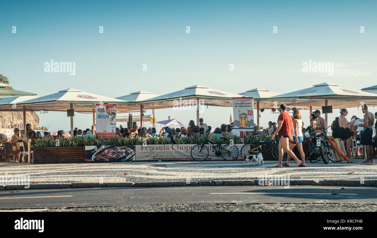 Rio de Janeiro, Brazil - Dec 17, 2017: Tourists and locals enjoy a drink at Kioskes along Copacabana Beach in Rio de Janeiro, Brazil Stock Photo