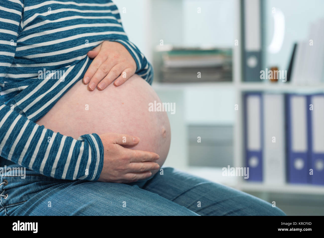 Pregnant woman at routine pregnancy checkup. Health care control for pregnant female. Stock Photo