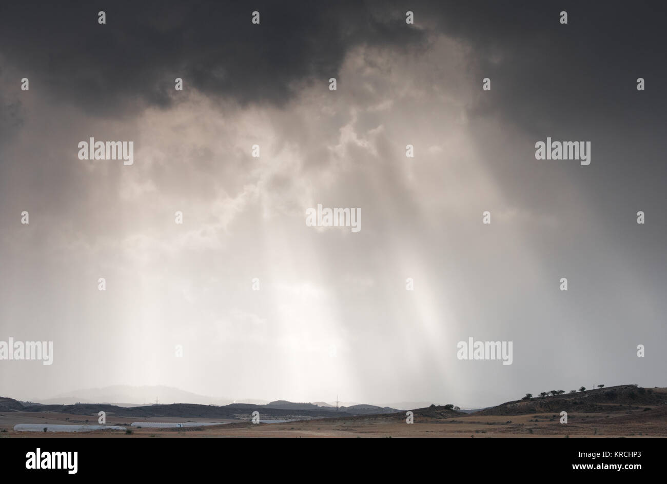 Sun rays between dramatic stormy clouds before the storm Stock Photo ...